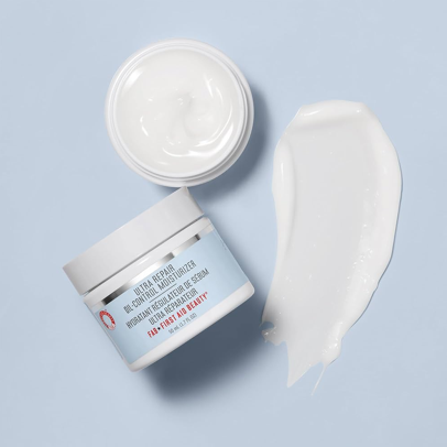 First Aid Beauty Ultra Repair Oil-Control Moisturizer in a white and blue tube with red accents.