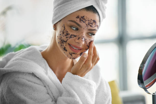 Woman gently exfoliating her face while wondering “can we use face scrub daily” for healthy glowing skin