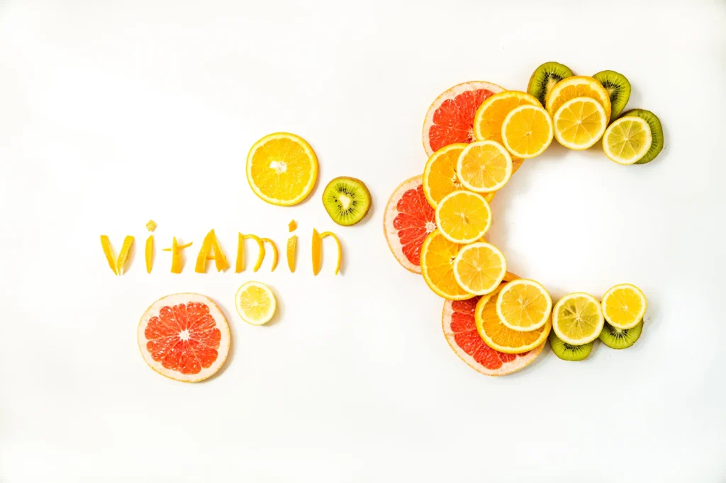 Fresh Vitamin C fruit slices representing natural skin brightening benefits.