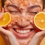 a girl doing her face scrub from lemon